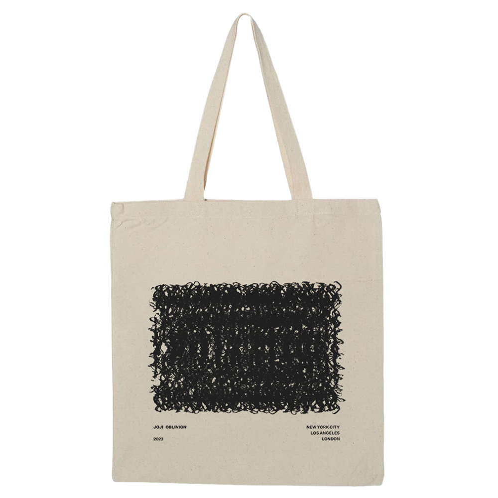 Canvas tote bag with a black abstract design printed on it.