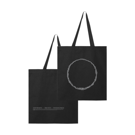 Two black tote bags with minimalist designs, one featuring a circular pattern and the other with text.